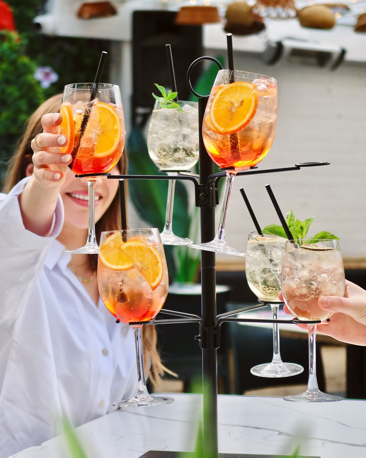 Cocktail tree with spritz and patio drinks at Somewhere Dine Bar