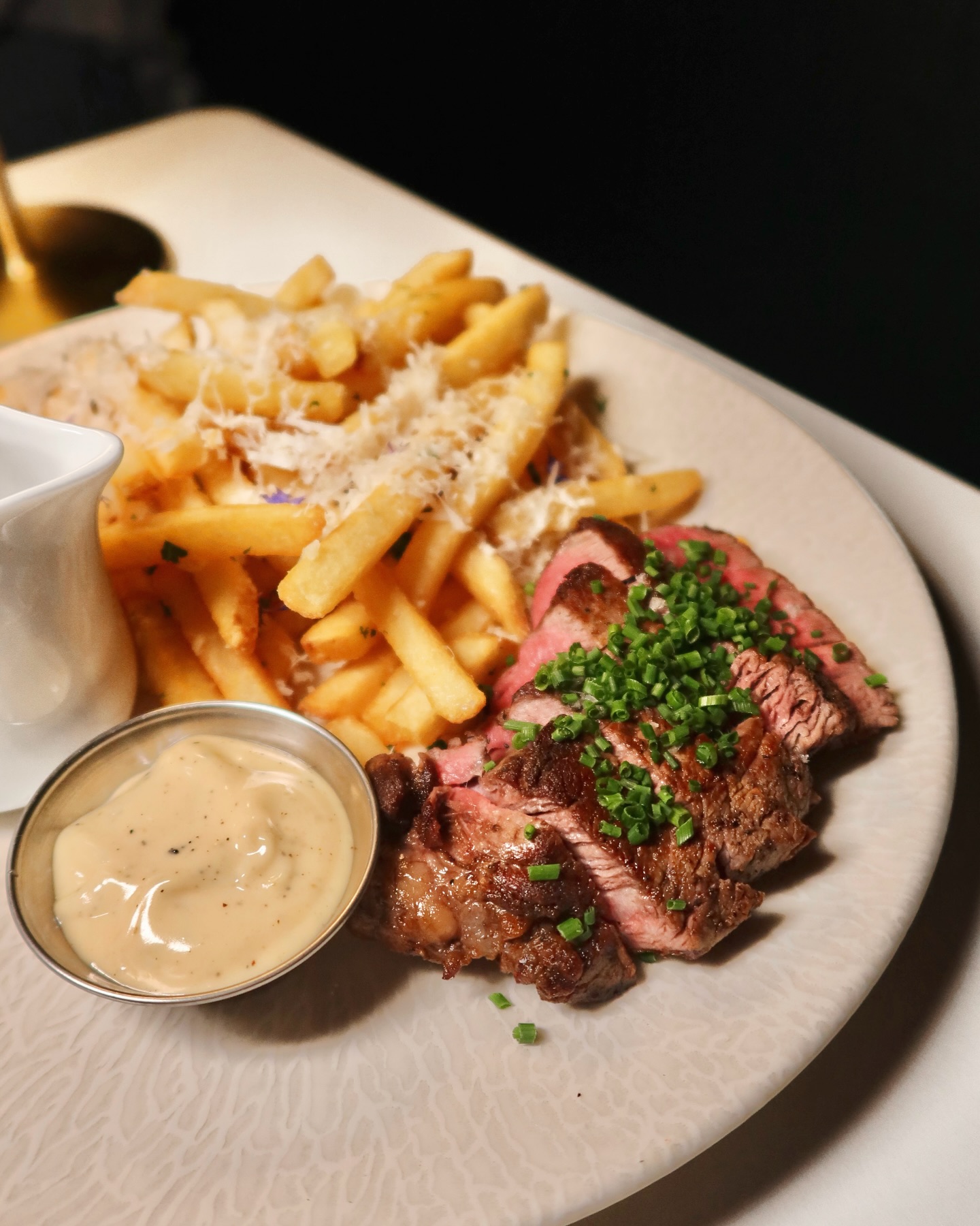 Tuna sashimi with chopsticks and garnishes at Somewhere Dine Bar