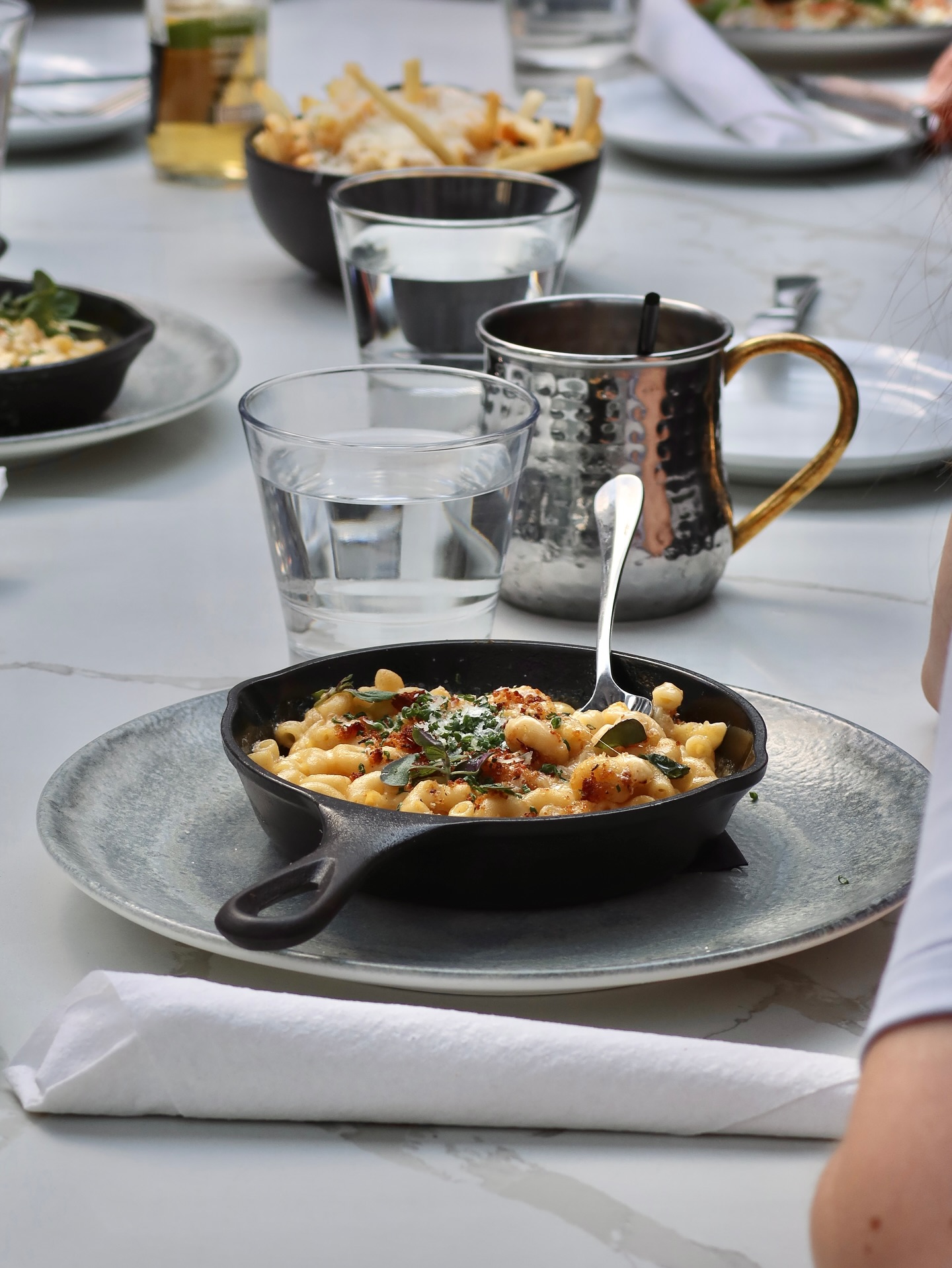 Shrimp cocktail with sauce and grilled lemon at Somewhere Dine Bar