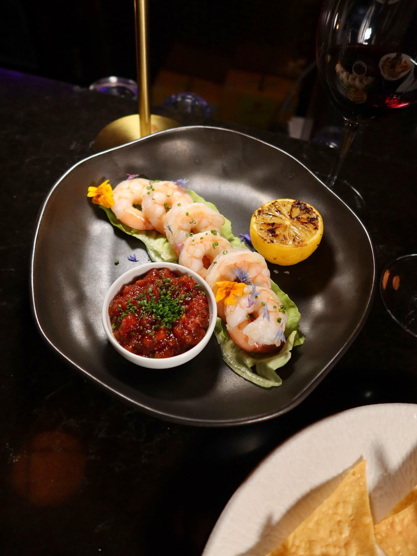 Oysters on ice with mignonette and garnishes at Somewhere Dine Bar