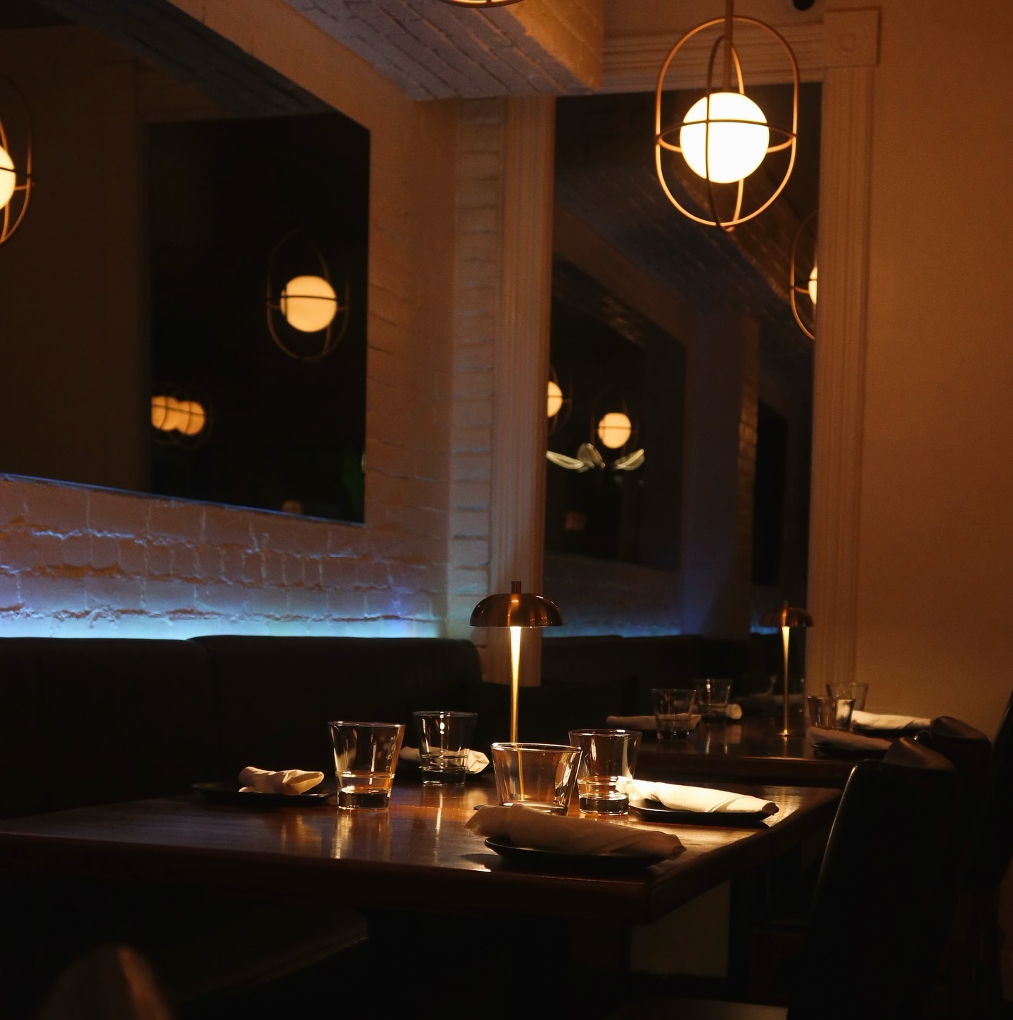 Guests dining in the intimate dining room at Somewhere Dine Bar